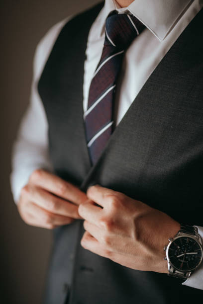 istock Guy is getting dressed for a business meeting. 2149884125