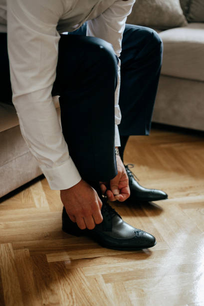 istock Guy is getting dressed for a business meeting. 2149884171