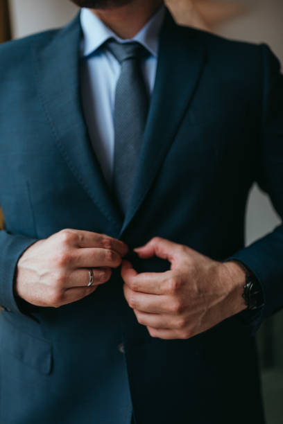 istock Guy is getting dressed for a business meeting. 2149884221