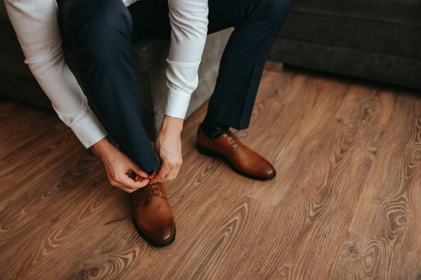 istock Guy is getting dressed for a business meeting. 2149884248