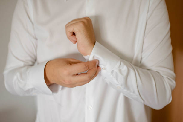 istock Guy is getting dressed for a business meeting. 2149884274