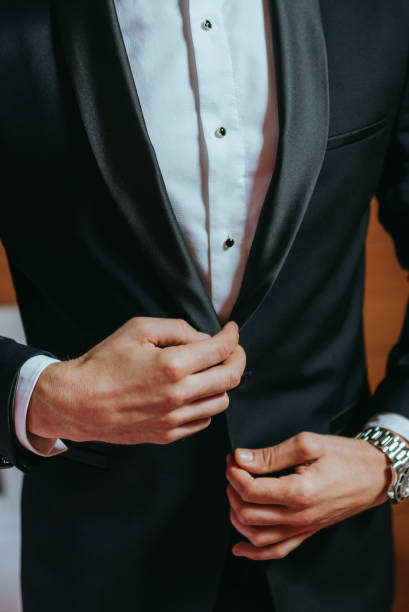 istock Guy is getting dressed for a business meeting. 2149884356
