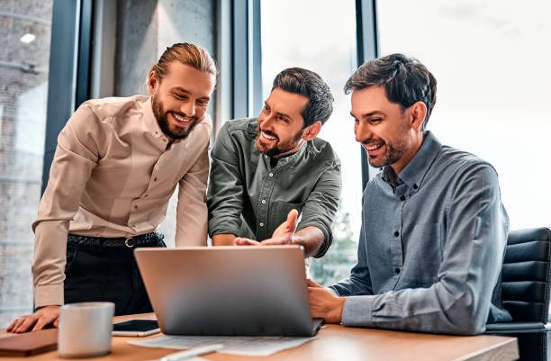 istock Business people in office workplace.Teamwork meeting. Collaboration, technology and workers, men with laptop planning sales, research or financial strategy in company. 2149884381