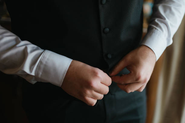 istock Guy is getting dressed for a business meeting. 2149884491