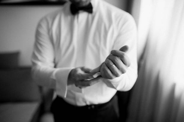 istock Guy is getting dressed for a business meeting. 2149885064