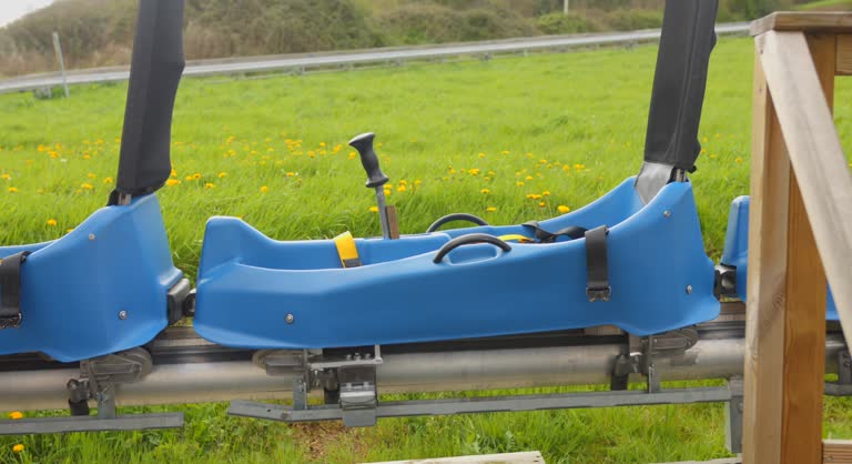 The blue sleds of an Alpine Coaster together at the start of the descent.