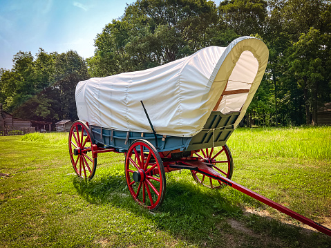 Rear and side view of a Horse Drawn Carriage or Covered Wagon.