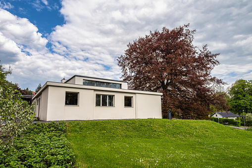 Weimar, Germany - May 12, 2023: Haus am Horn building in Weimar, Germany with grass lawn. Haus am Horn is the only truly Bauhaus building in Weimar.