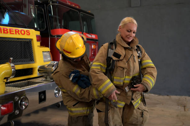 istock female firefighter preparing her equipment 2149888441