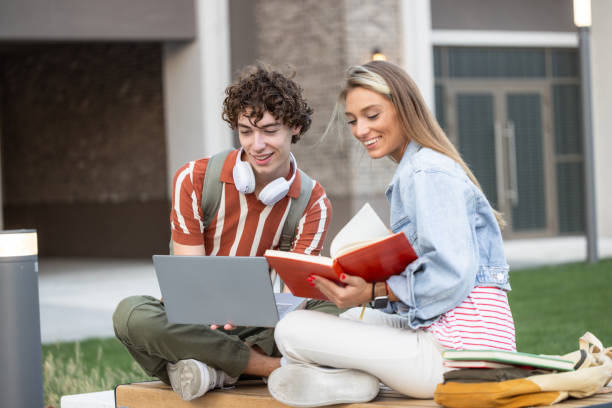 istock University students studying together outdoors, surrounded by the energy of campus life 2149888719