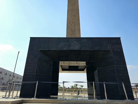 Giza, Egypt, April 13 2024: The obelisk from The Grand Egyptian Museum, Giza Museum, Egypt's gift to the world, the largest archaeological museum in the world, near the Giza pyramid complex, selective focus