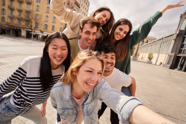 istock a group of young people are taking a selfie together 2149889391