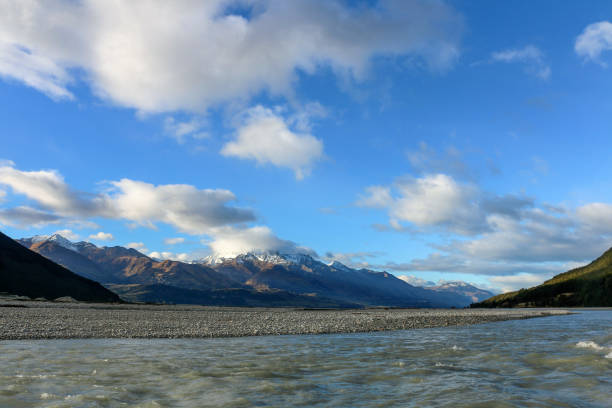 View of Milford Sound from a boat, with mountains, water and sky