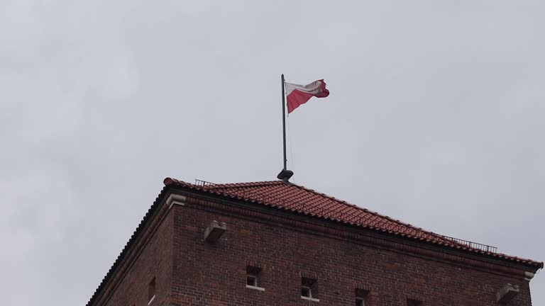 Polish Flag On Wawel Royal Castle In Krakow, Poland