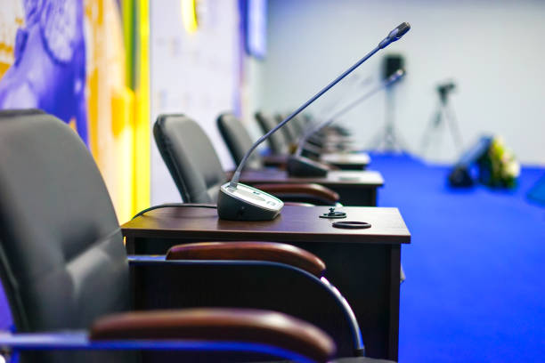 Conference room with microphones. Chairs in the conference hall.