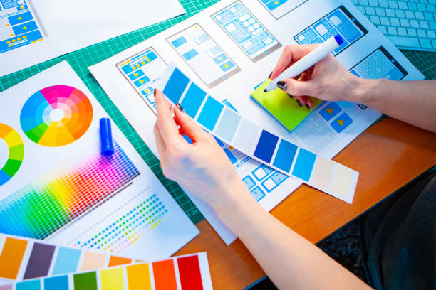 istock The designer works with polytry. Holds a palette in his hands. A man is looking for the right shade. Chooses which color to make. The choice of color for the application. Determines the correct hue. 2149890255