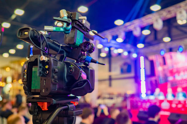 istock The professional camera is aimed at the scene. Professional camera on a tripod. Camera for video shooting near the audience. Concept - organization of video filming. Professional video shooting 2149890397