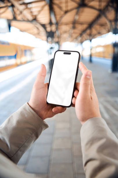 istock closeup Smart Phone mock up at the train station 2149890437