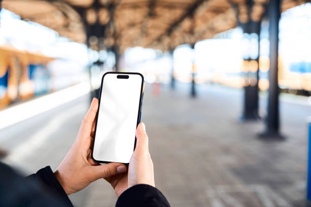 istock closeup Smart Phone mock up at the train station 2149890440
