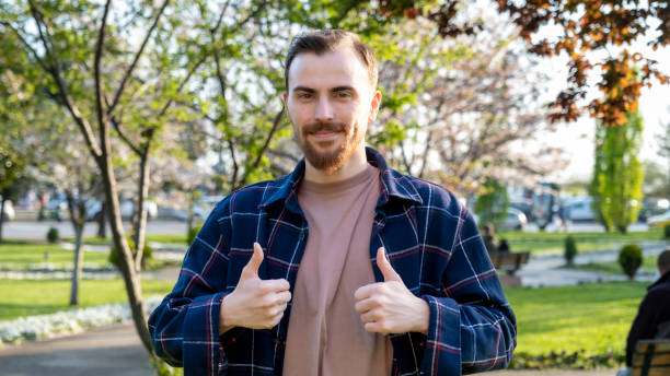 istock Positive Moment in the Tree-lined Park: Smiling Approval 2149891228