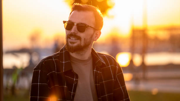 istock Tranquility on the Shore: The Charismatic Man at Sunset 2149891281