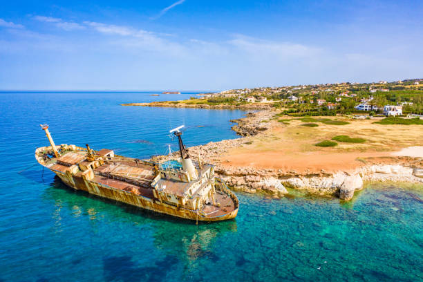 istock Cyprus. Pathos. White stone. Shipwreck. The ship ran aground top view. The ship crashed on the coastal rocks. Rusty ship at the shore of the Mediterranean sea. Tourist attractions of Cyprus. 2149891873