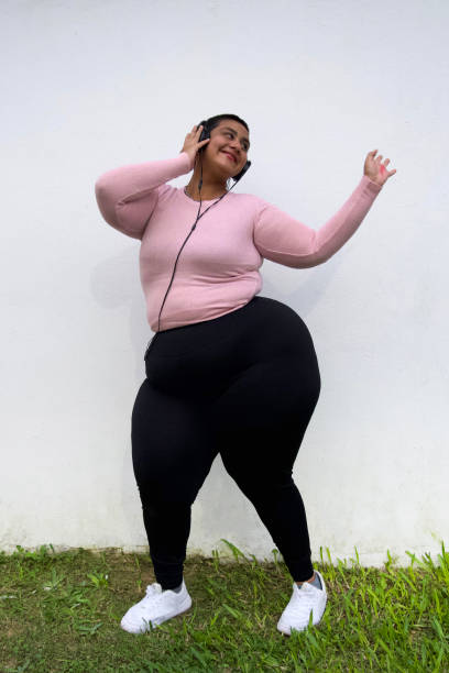 istock woman dancing with headphones 2149894843