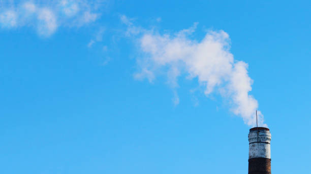 istock Old chimney with smoke against the sky. 2149896431