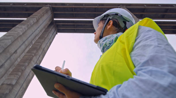 istock Female road engineer working. Building new highways. 2149898202