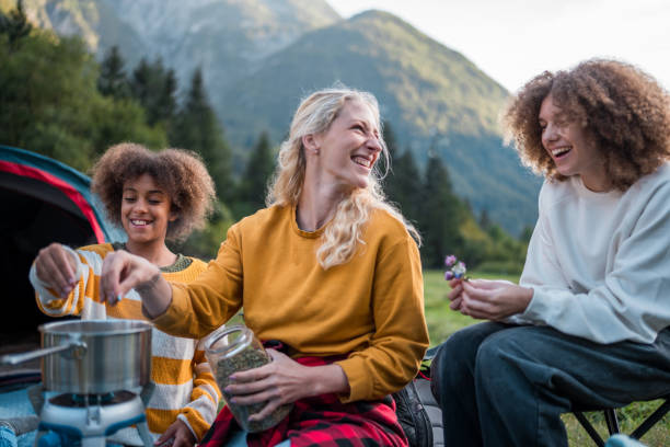 istock Family Camping Cooking Moment 2149898560
