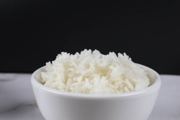 istock Thai Jasmine Rice in white bowl on table. Realistic Asian healthy food element. 2149899534