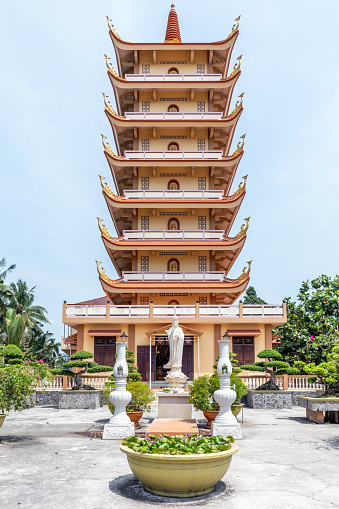 Tall pagoda at Vinh Trang Temple, My Tho, Vietnam.