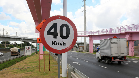 salvador, bahia, brazil - march 19, 2024: traffic signs indicate a speed limit of 40 kilometers per hour for vehicles traveling on the Federal highway BR 324.