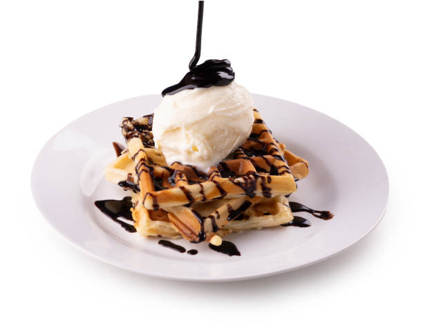 istock stacked waffles spilling chocolate syrup on round white plate with ice cream transparent background 2149907951