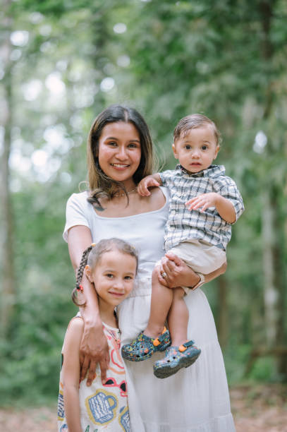 istock Modern Young mother with a small daughter enjoyg camp at park exploring nature 2149912221