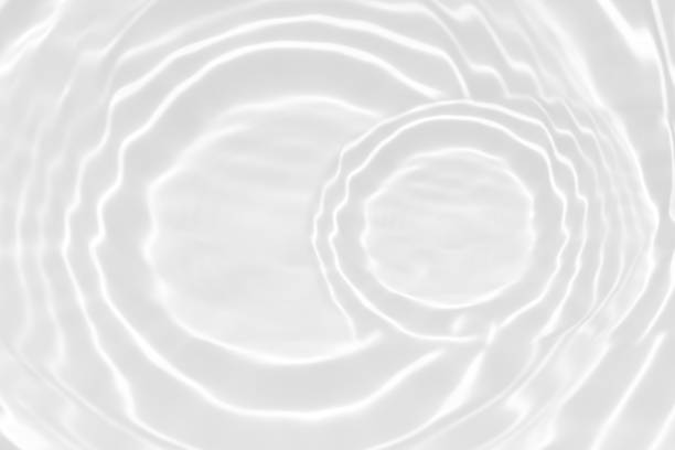 istock Bluewater waves on the surface ripples blurred. Defocus blurred transparent blue colored clear calm water surface texture with splash and bubbles. Water waves with shining pattern texture background. 2149912762