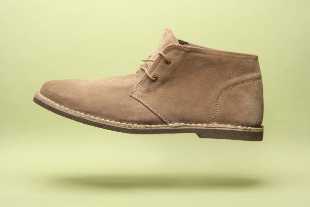 istock Desert shoe floating on green background 2149914961