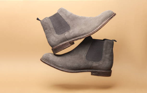istock Chelsea boots floating on beige background 2149914971