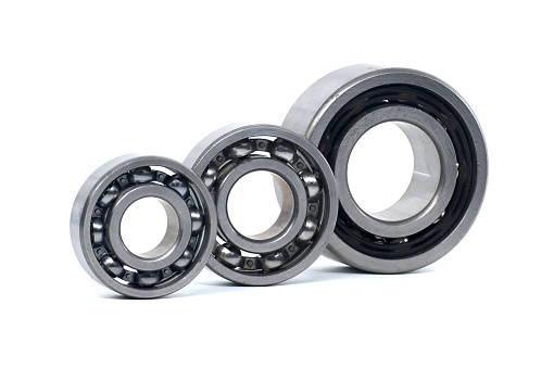 Ball bearings without seal and deep groove ball bearing with steel seal isolated on white background