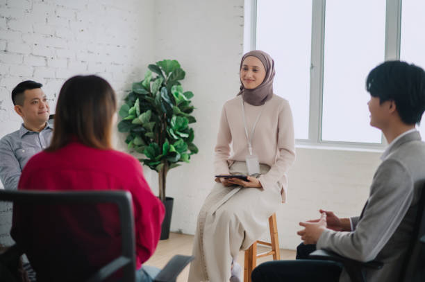 istock Anxious young woman sharing her struggles with her peers during a group therapy session 2149916046