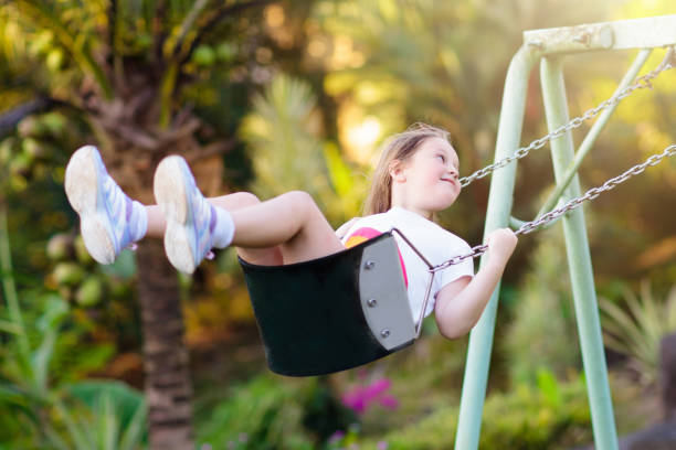 istock Child swinging on playground. Kids swing. 2149919817