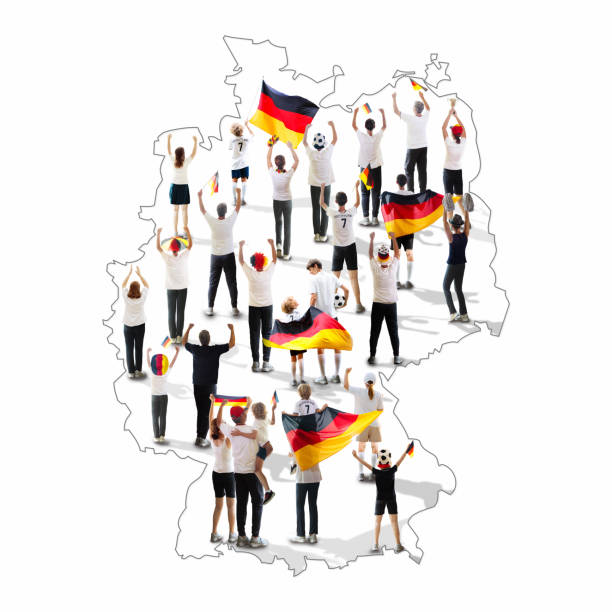German patriotic supporter and flag on Germany map. Group of supporters in national jersey cheering for Germany. Championship game. Aerial view of people with country flags. Sports event.
