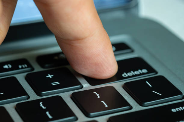 istock Finger of the computer user, he presses the delete button on the computer keyboard. 2149920879