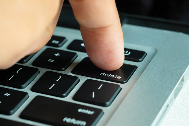 istock Finger of the computer user, he presses the delete button on the computer keyboard. 2149920881