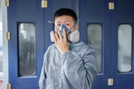 worker wearing gas mask