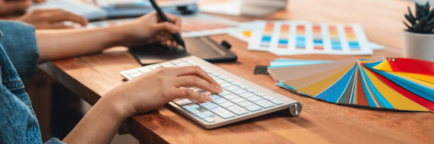 istock Graphic designer works on computer laptop with digital pen. Scrutinize 2149921680