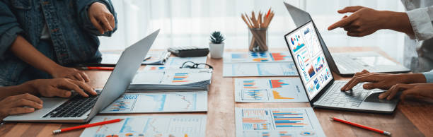Analyst team utilizing BI Fintech to analyze financial report. Scrutinize