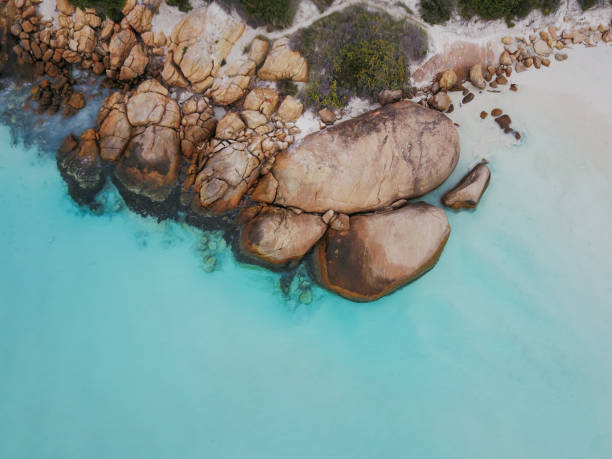 istock Clear blue ocean and rocky shoreline 2149921882