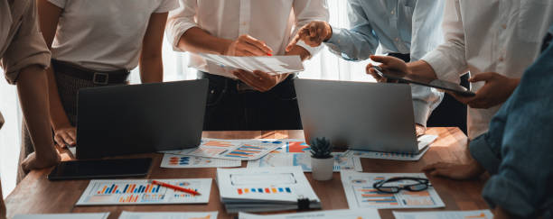 istock Analyst team utilizing BI Fintech to analyze financial dashboard. Scrutinize 2149922062
