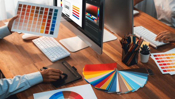 istock Graphic designer works on computer laptop with digital pen. Scrutinize 2149922260